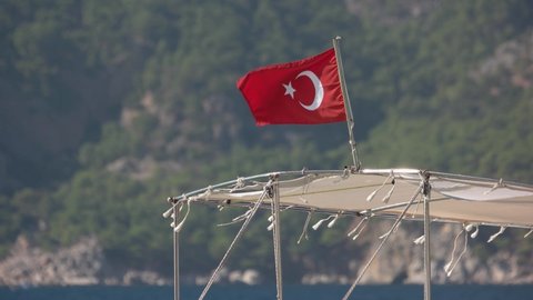Turkish flag on motor boat waving in the wind.