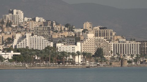 TIBERIAS, ISRAEL – DECEMBER 5 2021: Skyline of Tiberias on the Sea of Galilee, a popular holiday city and important place of worship in Israel
