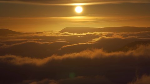 Cloud inversion sunrise timelapse from high in the Snowdonia mountains in Wales UK