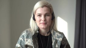 Pretty military woman making a video call - Powered by Shutterstock - Get 15% off with code: PIKWIZARD15