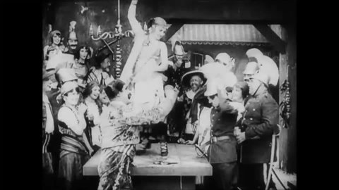 CIRCA 1915 - In this silent comedy, a soldier (Charlie Chaplin) dances on a tabletop, then carries off a beautiful woman.