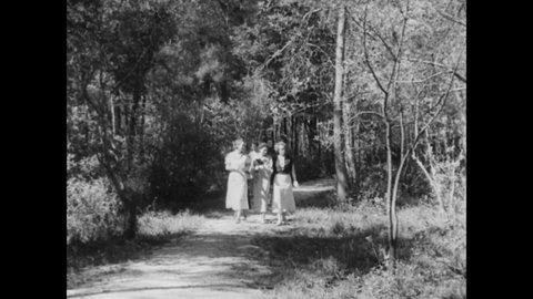 CIRCA 1933 - Women enjoy a picnic lunch at Alabama's Little River State Park.