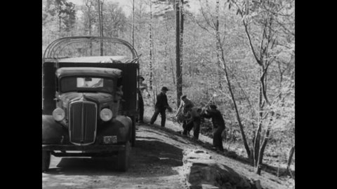 CIRCA 1937 - Men of the Civilian Conservation Corps build roads in Alabama's Shiawassee State Park.