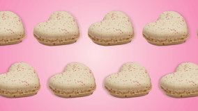 two lines with Heart shaped macarons pastel colors animated in different direction on a pink gradient background. Romantic Valentine's Day holidays concept.