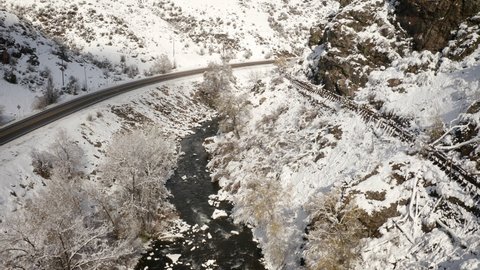 Aerial shot of the beautiful winter landscape along Clear Creek in Colorado USA
