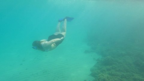 Underwater clip  fat woman diving in Moraira Alicante Spain Mediterranean sea