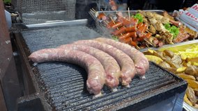Street food Festival pork sausages cooking on grill Macro Detail shot 4K video buying now.
