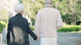 Asian elderly couple walking in the park. Second life. - Powered by Shutterstock - Get 15% off with code: PIKWIZARD15