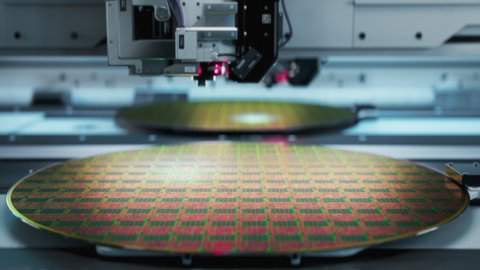 Shot of Silicon Wafer being processed at Advanced Semiconductor Foundry, that produces Computer Chips.