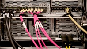 LED lights on a network switch with RJ45 and fibre optic cable in a data centre - Powered by Shutterstock - Get 15% off with code: PIKWIZARD15