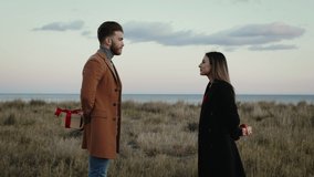 Engaged Couple Exchanges Gifts for valentines day - Powered by Shutterstock - Get 15% off with code: PIKWIZARD15