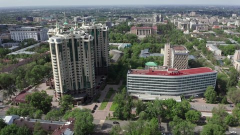 Almaty, Kazakhstan - May 19, 2020: Aerial wide view of Almaty Hotel and Stolichniy center apartments at summer bright sunny day. Panoramic view of the central district of Almaty.