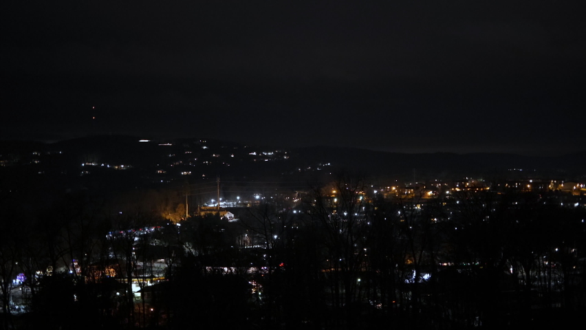 Mouintain top view of town, small city, suburbs, cars driving, carlights, 60fps