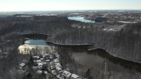 Germantown, Maryland, USA - Jan. 3, 2022: An aerial view of the Waters Landing neighborhood next to Lake Churchill. Black Hills Regional Park is visible in the distance.