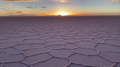 View of hexagonal formations on the surface of Salar de Uyuni in sunset, Bolivia