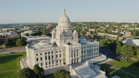 Aerial circular view Rhode Island Statehouse Capitol Building exterior with city panorama background, USA