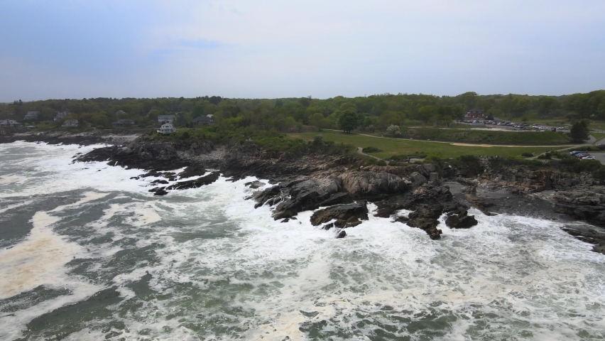 Aerial Drone Footage of Casco Bay near Portland Maine. Rough waves on the shore of the Atlantic