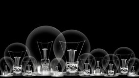 Group of light bulbs in a row going from dark to light with Digital Marketing, Brand, SEO, Business, Advertising and Strategy fiber text on black background. High quality 4k video.