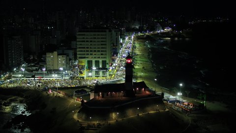 Salvador Bahia Brazil - 02 16 2020: Carnival in Salvador at night. View of Barra lighthouse in Salvador in Bahia, Brazil. image showing the Barra Ondina Circuit at the time of Carnival.