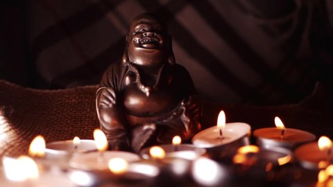 Buddhist meditation vigil with tea light candles bokeh medium dolly slow motion shot selective focus