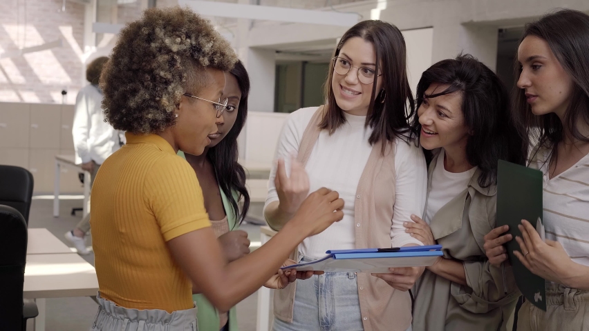 Female executive telling idea diverse project team at office meeting. Only Women Team working in a proyect. Royalty-Free Stock Footage #1085969372