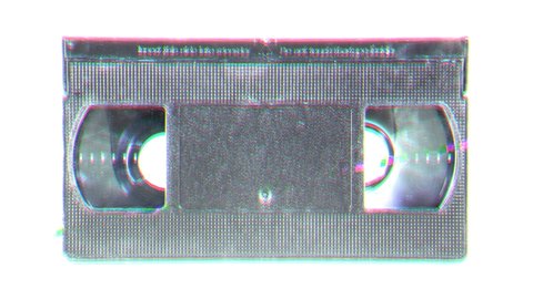 An old retro vintage VHS cassette tape, isolated on a white background, with a heavy glitch distortion effect.
