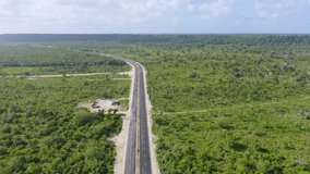 Veron Bavaro beltway crossing green area, Dominican Republic. Aerial forward