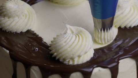Decorating Cake With Buttercream Frosting. - close up