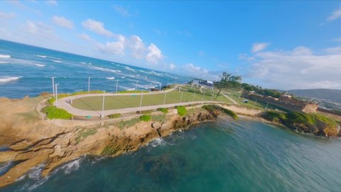 Drone flying over Puerto Plata seafront cultural center in Dominican Republic. Aerial fpv