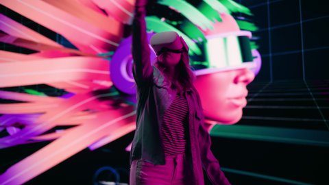 Digital Artist Making Presentation of a Modern VR Software for Producing 3D Art Pieces. Female Designer Uses Headset and Controllers to Showcase Functionality on a Big Screen on Stage.
