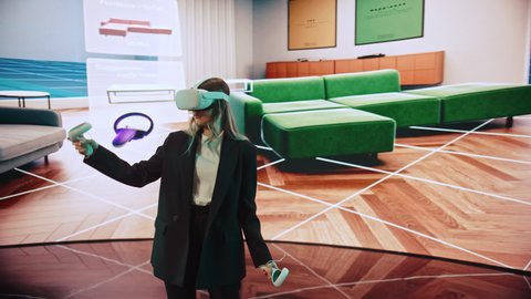 Interior Designer Making Presentation of a Modern VR Software for Designing Living Spaces. Female Engineer Uses Headset and Controllers to Showcase Functionality on a Big Screen on Stage.