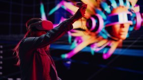 Digital Artist Using Virtual Reality 3D Software to Create a Beautiful Piece of Art in Interactive Creative Environment. Female Designer Using Virtual Reality Headset and Controllers for NFT Project. - Powered by Shutterstock - Get 15% off with code: PIKWIZARD15