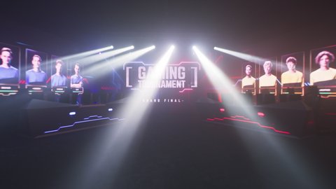 Zoom in large LED monitor with Gaming Tournament Grand Final inscription illuminated with red and blue neon lights in empty room with desks and computers