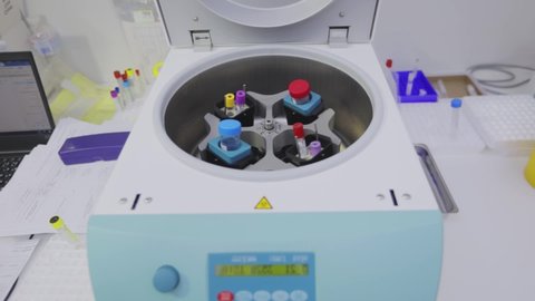 Rotation of medical samples in a laboratory centrifuge. Laboratory centrifuge. Medical centrifuge operation