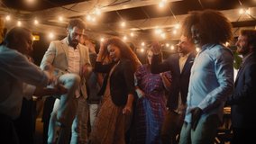 Beautiful Carefree Friends are Dancing Together and Celebrating an Evening Event at a Party . Diverse Multiethnic Young Adult People Have Fun at a Corporate Party in a Restaurant. - Powered by Shutterstock - Get 15% off with code: PIKWIZARD15