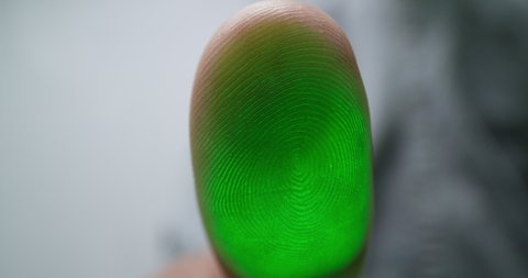 Access is approved. Close-up of a man puts his finger to the surface. Biometric scanner concept