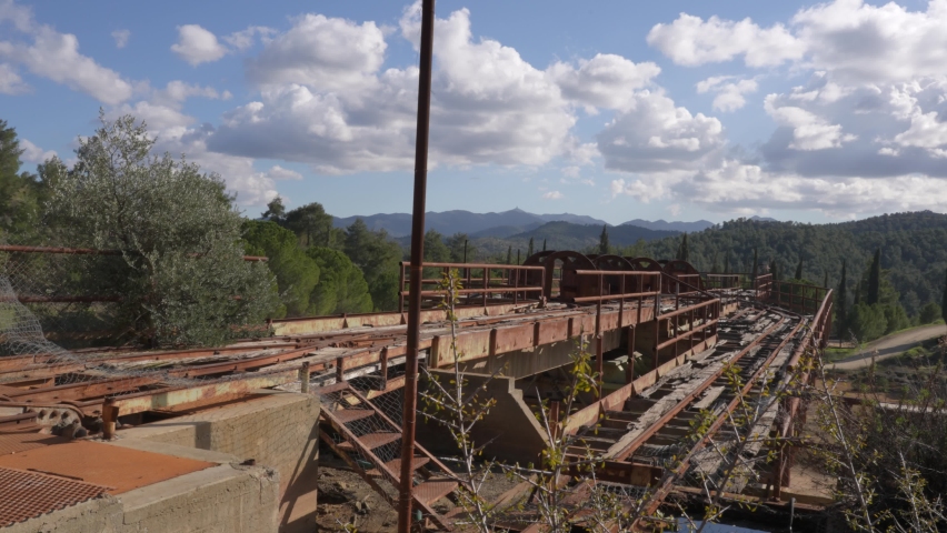 View of the outdoor rusty rails left over from the abandoned Mitsero copper mines.