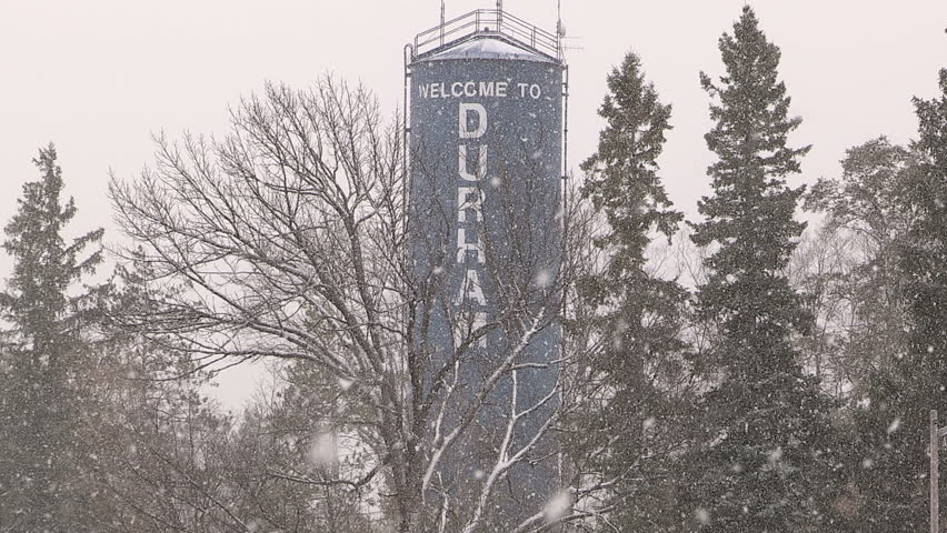 Ontario, Canada November 2014 Light to moderate pretty snow and windy in the the city on cold winter day.
