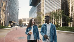Multiracial friends with coffee walking in city - Powered by Shutterstock - Get 15% off with code: PIKWIZARD15