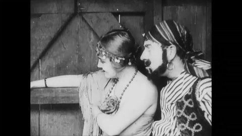 CIRCA 1915 - In this silent comedy, a Romani woman seduces a soldier (Charlie Chaplin) to distract him from his duties.