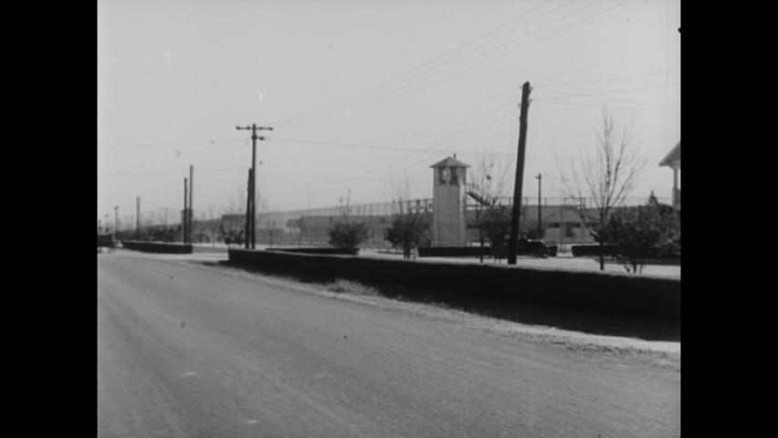 CIRCA 1933 - Inmates farm land at Alabama's Little River State Park, which is highly forested.