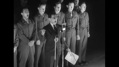 CIRCA 1948 - Irving Berlin a chorus of soldiers sing "Operation Vittles" at a USO show in Wiesbaden, Germany.
