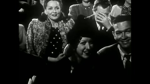 CIRCA 1947 - In this comedy movie, a woman is enthralled and her date is impressed by a gangster in a movie they go to see.