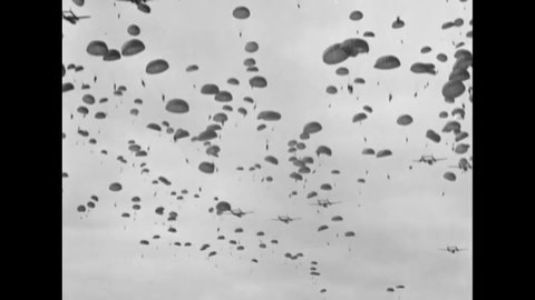 CIRCA 1951 - Paratroops of the 187th Airborne Regimental Combat Team land in Korea.