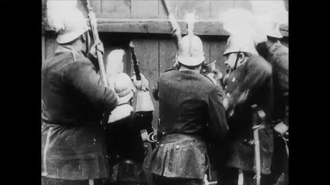 CIRCA 1915 - In this silent comedy, a woman cheers on a soldier (Charlie Chaplin) sword fighting another.