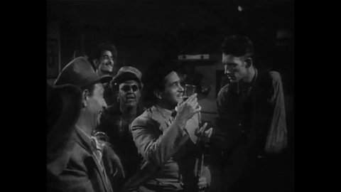 CIRCA 1955 - In this drama film, drug dealers make fun of an alcoholic's desperation.