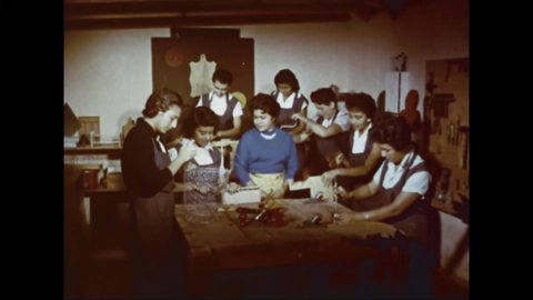 CIRCA 1960s - Guatemalan girls attend woodcarving and cooking classes.