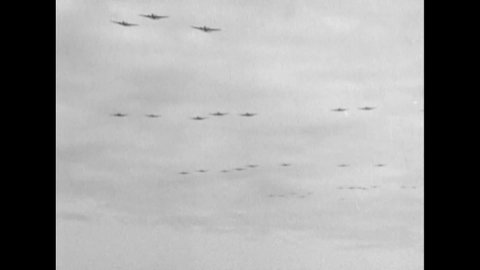 CIRCA 1951 - C-46 planes drop paratroops in Korea.