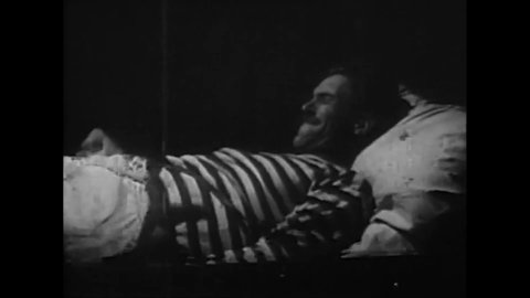 CIRCA 1943 - In this adventure movie, a drunken sailor stays in bed while his friend gives him a hard time.