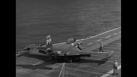 CIRCA 1954 - F2H-2P Banshee planes are catapulted from the flight deck of the USS Hornet.